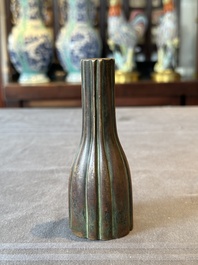 A rare Chinese ribbed bronze flower arranging vase, Ming