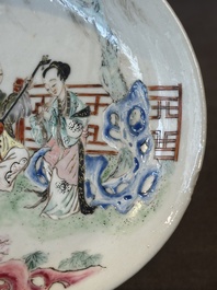 A Chinese famille rose cup and saucer with music making ladies, Yongzheng/Qianlong
