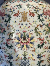 A pair of Chinese famille rose vases with floral design, Jiaqing mark, 19/20th C.