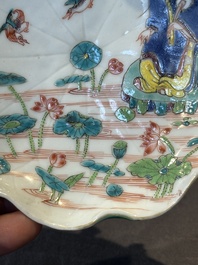 A Chinese famille rose relief-decorated 'lotus' cup and saucer, Yongzheng