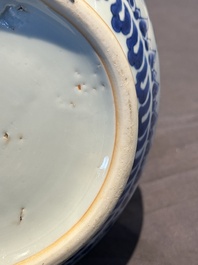 A Chinese blue and white 'lotus scroll' bottle vase, Transitional period