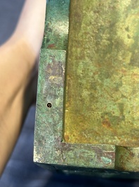 A rare large and inscribed archaistic bronze wine vessel, 'fang yi 方彝', Song/Ming