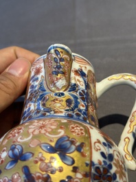 A Chinese English-decorated blue and white jug and cover, Kangxi