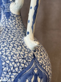 A pair of Chinese blue and white ewers with floral design, Kangxi