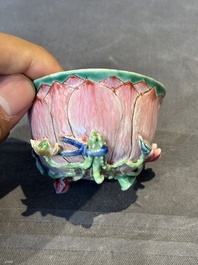 A Chinese famille rose relief-decorated 'lotus' cup and saucer, Yongzheng