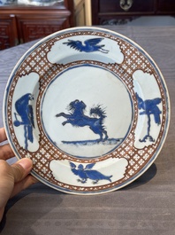 A pair of Chinese 'leaping pekinese' plates, possibly after a design by Cornelis Pronk, Qianlong, ca. 1740