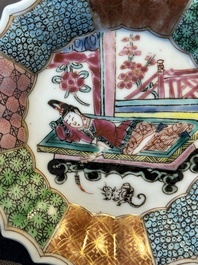 A Chinese famille rose cup and saucer with a reclined lady, Qianlong