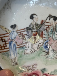 A Chinese famille rose cup and saucer with music making ladies, Yongzheng/Qianlong