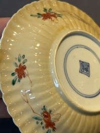 A pair of Chinese famille verte cafe-au-lait-ground cups and saucers, Kangxi