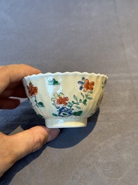 A pair of Chinese famille verte cafe-au-lait-ground cups and saucers, Kangxi