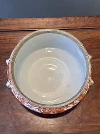 A Chinese iron-red-decorated covered bowl and a famille rose covered bowl, 19th C.