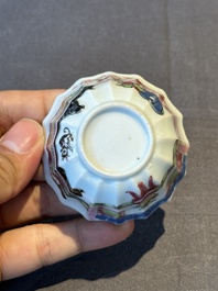 A Chinese famille rose cup and saucer with a reclined lady, Qianlong