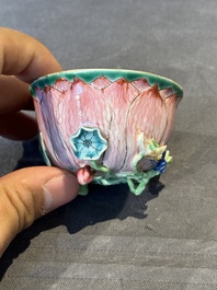 A Chinese famille rose relief-decorated 'lotus' cup and saucer, Yongzheng