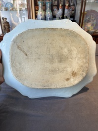 A Chinese famille rose 'He Xiangu' charger with a blue and white border, Qianlong