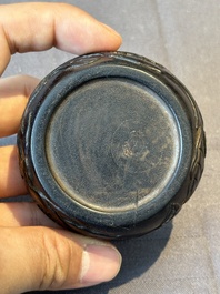 A Chinese huanghuali wooden box and cover with pomegranate design, 17/18th C.