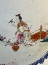A Chinese famille rose 'He Xiangu' charger with a blue and white border, Qianlong