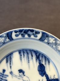A Chinese blue and white 'erotic' cup and saucer, Kangxi