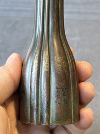 A rare Chinese ribbed bronze flower arranging vase, Ming