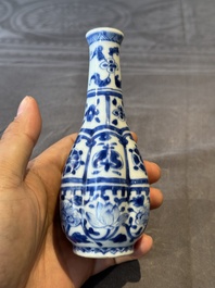 A Chinese blue and white facetted bottle vase with floral design, Kangxi