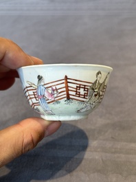 A Chinese famille rose cup and saucer with music making ladies, Yongzheng/Qianlong