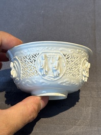 A pair of rare Chinese reticulated white-glazed biscuit 'Eight Immortals and Shoulao' bowls, Wanli