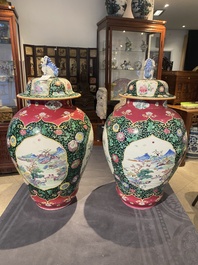 A pair of Chinese famille rose black-ground jars and covers with mountainous landscape design, Yongzheng