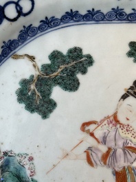 A Chinese famille rose 'He Xiangu' charger with a blue and white border, Qianlong