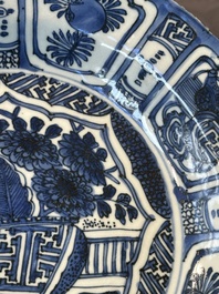 A Chinese blue and white kraak porcelain dish with flowers in a jardiniere, Wanli