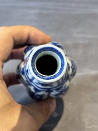 A Chinese blue and white facetted bottle vase with floral design, Kangxi