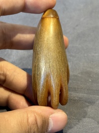 A rare Chinese rhinoceros horn snuff bottle in the shape of a Buddha hand, 19th C.