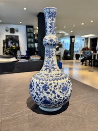 A Chinese blue and white 'lotus scroll' bottle vase, Transitional period