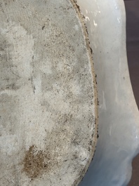 A Chinese famille rose 'He Xiangu' charger with a blue and white border, Qianlong
