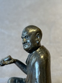 A small Chinese bronze figure of a Luohan, Ming