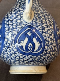 A pair of Chinese blue and white ewers with floral design, Kangxi