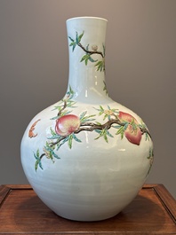 A Chinese famille rose relief-moulded 'tianqiuping' vase with nine peaches, Qianlong mark, 19/20th C.