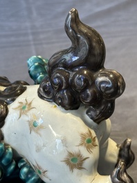 A Japanese polychrome-glazed group of playing Buddhist lions, 18/19th C.