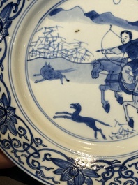 A pair of Chinese blue and white 'hunting scene' plates, Qi Yu Bao Ding Zhi Zhen 奇玉寶鼎之珍 mark, Kangxi