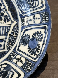 A Chinese blue and white kraak porcelain dish with flowers in a jardiniere, Wanli