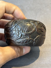 A Chinese huanghuali wooden box and cover with pomegranate design, 17/18th C.