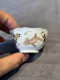 A Chinese polychrome cup and saucer with figures and a dog, Yongzheng