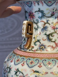 A pair of Chinese famille rose vases with floral design, Jiaqing mark, 19/20th C.