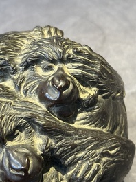 A Japanese bronze okimono with three monkeys, Yoshinobu seal mark, Meiji period