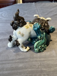 A Japanese polychrome-glazed group of playing Buddhist lions, 18/19th C.