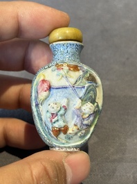 A Chinese moulded famille rose 'playing boys' snuff bottle, Qianlong mark, 19th C.
