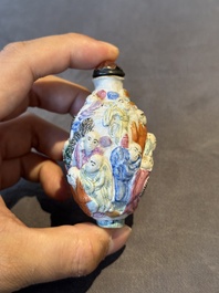 Six Chinese moulded famille rose snuff bottles, Qianlong mark, 19th C.