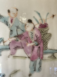 A pair of Chinese famille rose jars and covers with figures in a garden, Tongzhi mark and of the period