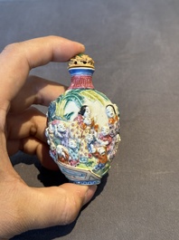 A Chinese famille rose moulded snuff bottle, Qianlong mark, late 18th/early 19th C.
