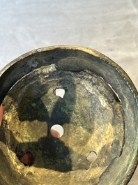 Two Chinese Chinese bronze cylindrical incense stick holders and a covered censer, Yuan/Ming and Qing