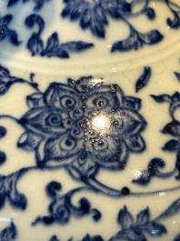 A Chinese blue and white 'lotus scroll' bottle vase, 18/19th C.