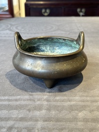 A Chinese bronze tripod censer, Guan Huai Tang Zhu Ren 冠槐堂主人 mark, 17/18th C.